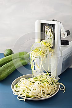 Spiralizing courgette raw vegetable with spiralizer