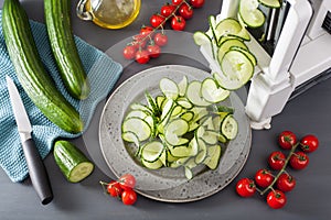 Spiralizing cucumber vegetable with spiralizer