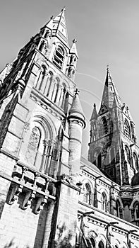 The spire of an Anglican church in Cork, Ireland. Neo-Gothic Christian religious architecture. Cathedral Church of St Fin Barre,