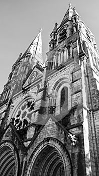 The spire of an Anglican church in Cork. Neo-Gothic Christian religious architecture. Cathedral Church of St Fin Barre, Cork - One