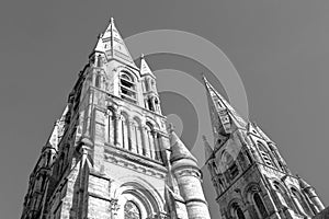 The spire of an Anglican church in Cork. Neo-Gothic Christian religious architecture. Cathedral Church of St Fin Barre, Cork - One