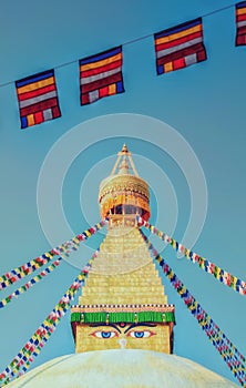The spire of Bodhnath Stupa, Kathmandu, Nepal, with Buddhist prayer flags