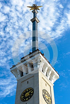 Spire of Northern River Terminal with clock and star, Moscow, Russia. Old building in Stalinist style renovated in 2020