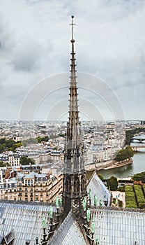 The spire of Notre Dame de Paris, panoramic view of Paris and river Seine from the roof of Notre Dame cathedral, France