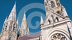 The spires of the Anglican Cathedral of St. Fin Barre in the Irish city of Cork. A Christian church in the Neo-Gothic style. sky,