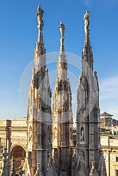 The spires and pinnacle sculptures on the roof of the Milan Cathedral