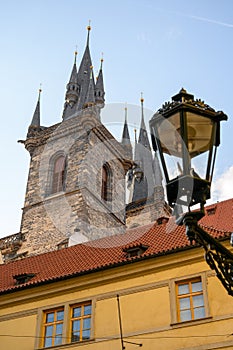 Spires, rooftops and an old street light in Prague, Czech Republic