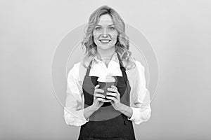 Spirit of Expertise. cheerful girl drinking tea. woman in apron with plastic cup. good morning