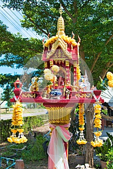 Spirit house in a garden in Lom Sak, Thailand