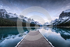 Spirit Island with wooden pier and Canadian Rockies on Maligne lake at Jasper national park, Canada