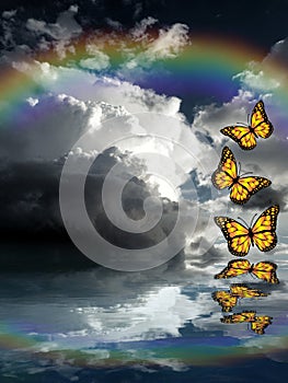 Spiritual background for meditation with butterflies, stormy clouds and rainbow in sea reflection