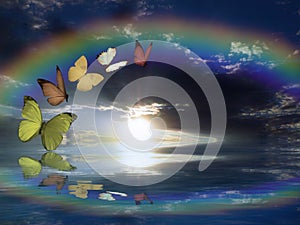 Spiritual background for meditation with butterflies, stormy clouds and rainbow in sea reflection