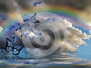 Spiritual background for meditation with butterflies, stormy clouds and rainbow in sea reflection