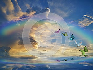 Spiritual background for meditation with clouds sky, rainbow and butterflies