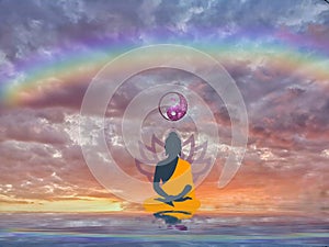 Spiritual background for meditation with human silhouette with rainbow in sea reflection