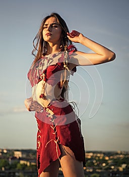 Spiritual development. Woman wear leather clothes sky background. Ethnic tribal concept. Sexy girl. Tribal clothing