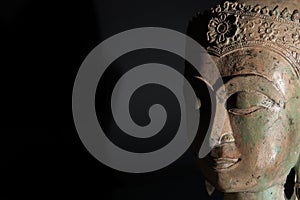 Spiritual enlightenment. Buddha statue head with copy space.