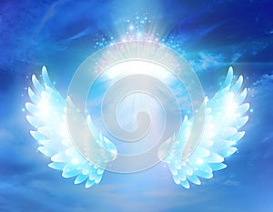 Spiritual guidance, divine energy, Angel of light and love doing a miracle on sky, blue angelic wings