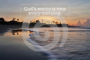 Spiritual inspirational quote - God`s mercy is new every morning. On background of beach nature landscape and smooth waves motion photo