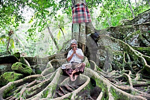 Spiritual man sits under the tree