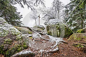 Spiritual stone - summit cross and viewing platform of the Panorama Tour circular hiking trail in the Bavarian Forest near Grafena