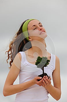 Spiritual woman planting a flower