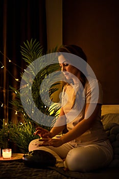Spiritual yoga woman playing melody on glucophone practice mindfulness harmony balance at bedroom