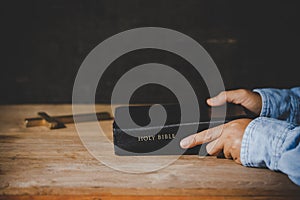 Spirituality and religion, Hands folded in prayer on a Holy Bible