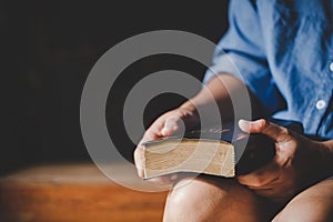 Spirituality and religion, Hands folded in prayer on a Holy Bible