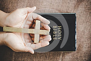 Spirituality and religion, Hands folded in prayer on a Holy Bible