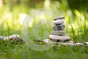 Spirituality: Stone cairn in the park. Balance and relaxation photo