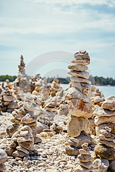 Spirituality and wellness: Cairns on a pebble beach