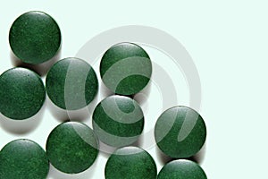 Spirulina pills, algae superfood. Dietary supplement tablets, natural alternative medicine