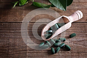 Spirulina pills on a rustic table