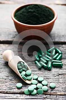 Spirulina powder and tablets photo