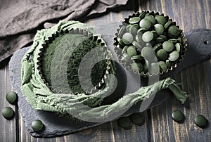 Spirulina tablets and powder photo