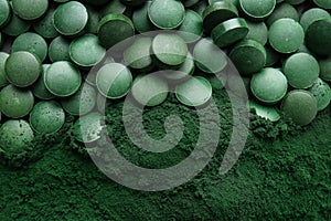 Spirulina tablets with powder, top view