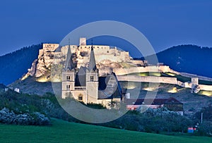 Spissky hrad castle and Spisska Kapitula in the evening