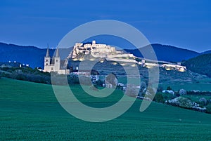 Spissky hrad castle and Spisska Kapitula in the evening