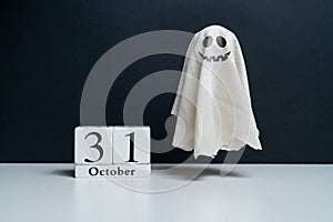 spiteful ghost next to October calendar. Halloween holiday. Halloween holiday. photo