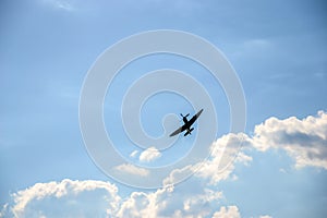 Spitfire on blue cloudy sky