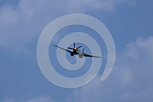 Spitfire plane in flight on sunny day