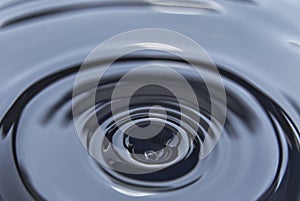 Splash on the black petroleum surface