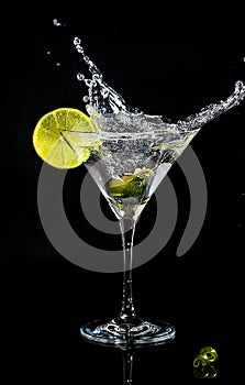 Splash of a cocktail in martini glass
