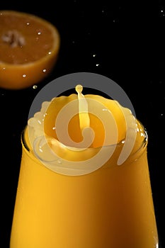 Splash in a glass of orange juice