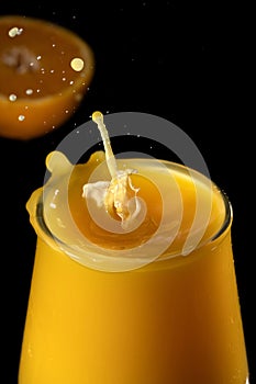 Splash in a glass of orange juice