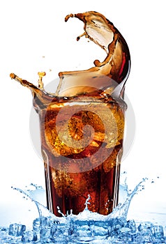 Splash from ice cubes in a glass of cola, isolated on the white background