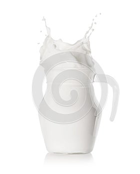 Splash of milk in a filled glass jug