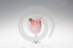 Splash of milk strawbery in a glass
