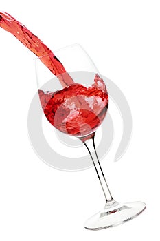 Splash of red wine in the glass